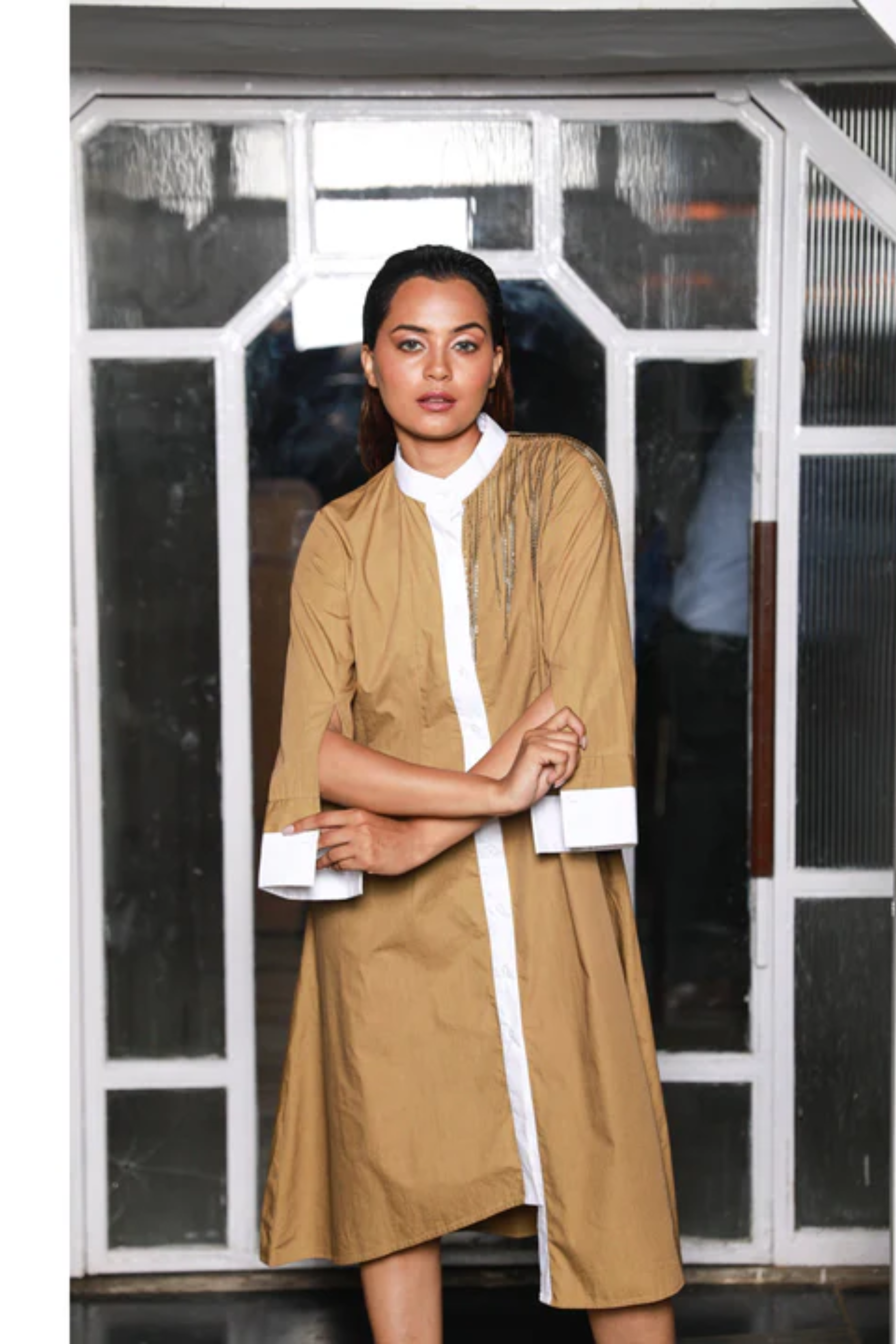 Khaki shirt dress features white mandarin collar, white cuffs and chain feature on the shoulder.